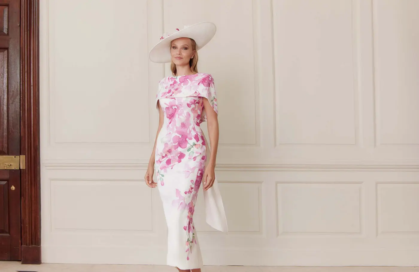 Woman in pink and white floral dress wide shot in Ballyclare