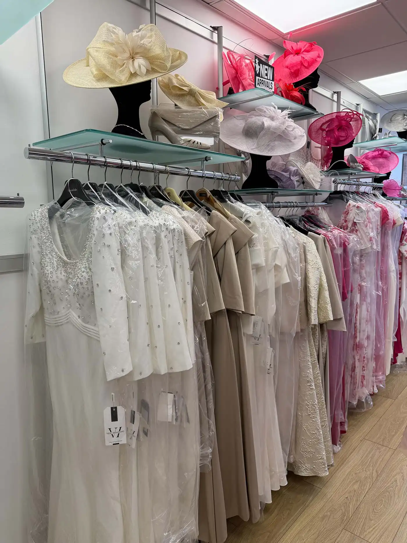 White mothers of the bride and groom dresses and hats in Ballyclare